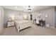 Bright bedroom with a cozy bed, a functional desk area, and stylish decor, perfect for relaxation and productivity at 5009 Hanover Ln, Lakeland, FL 33813
