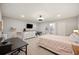 Spacious bedroom featuring a cozy bed, a functional desk area, and a television, perfect for relaxation and productivity at 5009 Hanover Ln, Lakeland, FL 33813
