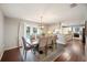 Dining room featuring an updated light fixture and views of the pool through the glass patio doors at 5009 Hanover Ln, Lakeland, FL 33813
