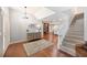 Open foyer with hardwood flooring, staircase, and decorative furnishings offers a grand entrance at 5009 Hanover Ln, Lakeland, FL 33813