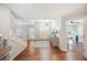 Bright foyer with wood floors, staircase, and arched window over the front door creates an inviting entryway at 5009 Hanover Ln, Lakeland, FL 33813