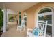 Lovely front porch showcases rocking chairs and a swing offering a cozy and inviting outdoor space at 5009 Hanover Ln, Lakeland, FL 33813