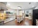 Well-lit kitchen featuring white cabinets, granite countertops, and a functional center island at 5009 Hanover Ln, Lakeland, FL 33813