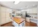 Inviting kitchen featuring modern appliances, an island with seating, and ample cabinet space at 5009 Hanover Ln, Lakeland, FL 33813