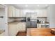 Charming kitchen featuring white cabinets, granite counters, stainless steel fridge, and center island at 5009 Hanover Ln, Lakeland, FL 33813