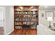 Stylish built-in shelving provides ample storage and showcases decor in this cozy living space at 5009 Hanover Ln, Lakeland, FL 33813
