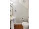 Stylish powder room with a classic pedestal sink, a gold-framed mirror, and elegant fixtures enhancing its charm at 5009 Hanover Ln, Lakeland, FL 33813