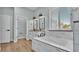 Bathroom with soaking tub, marble countertops, and modern fixtures at 570 Gandhi Dr, Lakeland, FL 33813