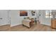 Dining room features colorful abstract art, table with seating for four and light-colored flooring at 570 Gandhi Dr, Lakeland, FL 33813
