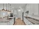 Modern kitchen featuring granite countertops, stainless steel appliances, and pendant lighting at 570 Gandhi Dr, Lakeland, FL 33813