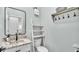 Stylish powder room with decorative ladder, marble countertop, and modern black faucet, offering a chic and functional space at 570 Gandhi Dr, Lakeland, FL 33813