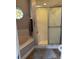 Bathroom featuring a glass-door shower and a large soaking tub at 5982 Crane Dr, Lakeland, FL 33809