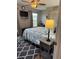 Well-lit bedroom features a bed, modern decor, and window views at 5982 Crane Dr, Lakeland, FL 33809