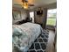 Bedroom features a desk, ceiling fan, and natural light at 5982 Crane Dr, Lakeland, FL 33809