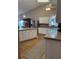 Bright kitchen featuring white cabinetry, a large island, and stainless steel appliances at 5982 Crane Dr, Lakeland, FL 33809
