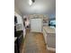 Well-lit kitchen with granite countertops, a breakfast bar, and modern appliances at 5982 Crane Dr, Lakeland, FL 33809