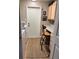 Functional laundry room provides a convenient workspace with storage cabinets and countertop space at 5982 Crane Dr, Lakeland, FL 33809