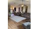 Large living room with hardwood floors, comfortable seating, and decorative accents at 5982 Crane Dr, Lakeland, FL 33809