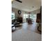 Spacious open-concept living room with dining area, fireplace, and lots of natural light at 5982 Crane Dr, Lakeland, FL 33809