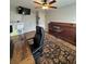 Comfortable office area features hardwood style floors, large desk, ceiling fan, and built in cabinet at 5982 Crane Dr, Lakeland, FL 33809