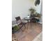 Cozy outdoor patio area with stylish seating, plants and a round window detail at 5982 Crane Dr, Lakeland, FL 33809