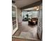 Inviting sunroom with wood-look floors, lots of natural light, and comfortable seating at 5982 Crane Dr, Lakeland, FL 33809