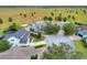 Aerial view of a two-story home surrounded by mature trees, a spacious yard, and a private driveway at 1935 Austin Ter, Winter Haven, FL 33884