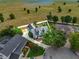 Aerial view of a home showcasing the backyard and surrounding landscape, surrounded by white border at 1935 Austin Ter, Winter Haven, FL 33884