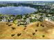 Neighborhood aerial view, showcasing lakeside community, and well-maintained homes at 1935 Austin Ter, Winter Haven, FL 33884