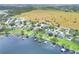 Panoramic aerial view of a lakefront community with homes, docks, and lush greenery, showing the expansive landscape at 1935 Austin Ter, Winter Haven, FL 33884
