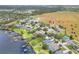 Aerial view of the home in a lakeside community with a spacious backyard, ideal for families and outdoor enjoyment at 1935 Austin Ter, Winter Haven, FL 33884