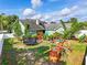 Large fenced backyard featuring a playground and trampoline at 1935 Austin Ter, Winter Haven, FL 33884