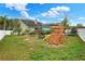 Spacious backyard with a playground and trampoline for outdoor fun and games, perfect for  at 1935 Austin Ter, Winter Haven, FL 33884