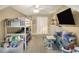 Bedroom with carpet, a bunk bed, and a desk with an office chair and wall mounted television on the wall at 1935 Austin Ter, Winter Haven, FL 33884