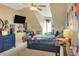 A cozy bedroom features a ceiling fan and neutral walls, a comfortable bed and fun decorative items at 1935 Austin Ter, Winter Haven, FL 33884