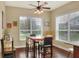 Sunlit breakfast nook with hardwood floors, large windows, and a ceiling fan, perfect for casual dining at 1935 Austin Ter, Winter Haven, FL 33884