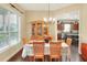 Charming dining room featuring hardwood floors, recessed lighting, and a view into the adjacent kitchen at 1935 Austin Ter, Winter Haven, FL 33884