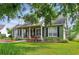 Beautiful home with black shutters, complemented by well-maintained landscaping and lush green lawn at 1935 Austin Ter, Winter Haven, FL 33884