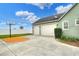 Three-car garage with a basketball hoop on the driveway, providing parking and recreational space at 1935 Austin Ter, Winter Haven, FL 33884