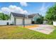 Attached two-car garage with driveway basketball court and well maintained lawn at 1935 Austin Ter, Winter Haven, FL 33884