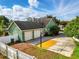 Three-car garage and basketball hoop on driveway, providing ample parking and entertainment space at 1935 Austin Ter, Winter Haven, FL 33884