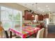 Bright kitchen with hardwood floors, granite countertops, stainless steel appliances, and a breakfast nook at 1935 Austin Ter, Winter Haven, FL 33884