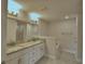 The main bathroom offers dual sinks with granite counters, and a walk-in shower at 4688 Grandview Glen Dr, Auburndale, FL 33823