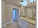 Bathroom with granite countertop, double sinks, tile, and a mirror at 4688 Grandview Glen Dr, Auburndale, FL 33823