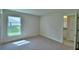 Bedroom with neutral paint, carpeting, and window with outside views at 4688 Grandview Glen Dr, Auburndale, FL 33823