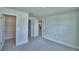 Bedroom featuring carpeted floor, base molding, and walk-in closet at 4688 Grandview Glen Dr, Auburndale, FL 33823