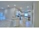Modern kitchen featuring white cabinets, granite countertops, and stainless steel appliances at 4688 Grandview Glen Dr, Auburndale, FL 33823