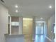 Bright open floor plan featuring tile flooring, kitchen, and dining area at 4688 Grandview Glen Dr, Auburndale, FL 33823
