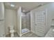 Neutral bathroom featuring walk-in shower with glass door, tiled walls and modern fixtures at 4694 Grandview Glen Dr, Auburndale, FL 33823