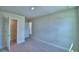 Spacious carpeted bedroom with walk-in closet and ensuite bathroom entrance at 4694 Grandview Glen Dr, Auburndale, FL 33823